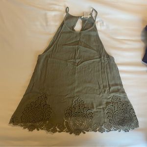 Green tank with cute crochet design on the front.